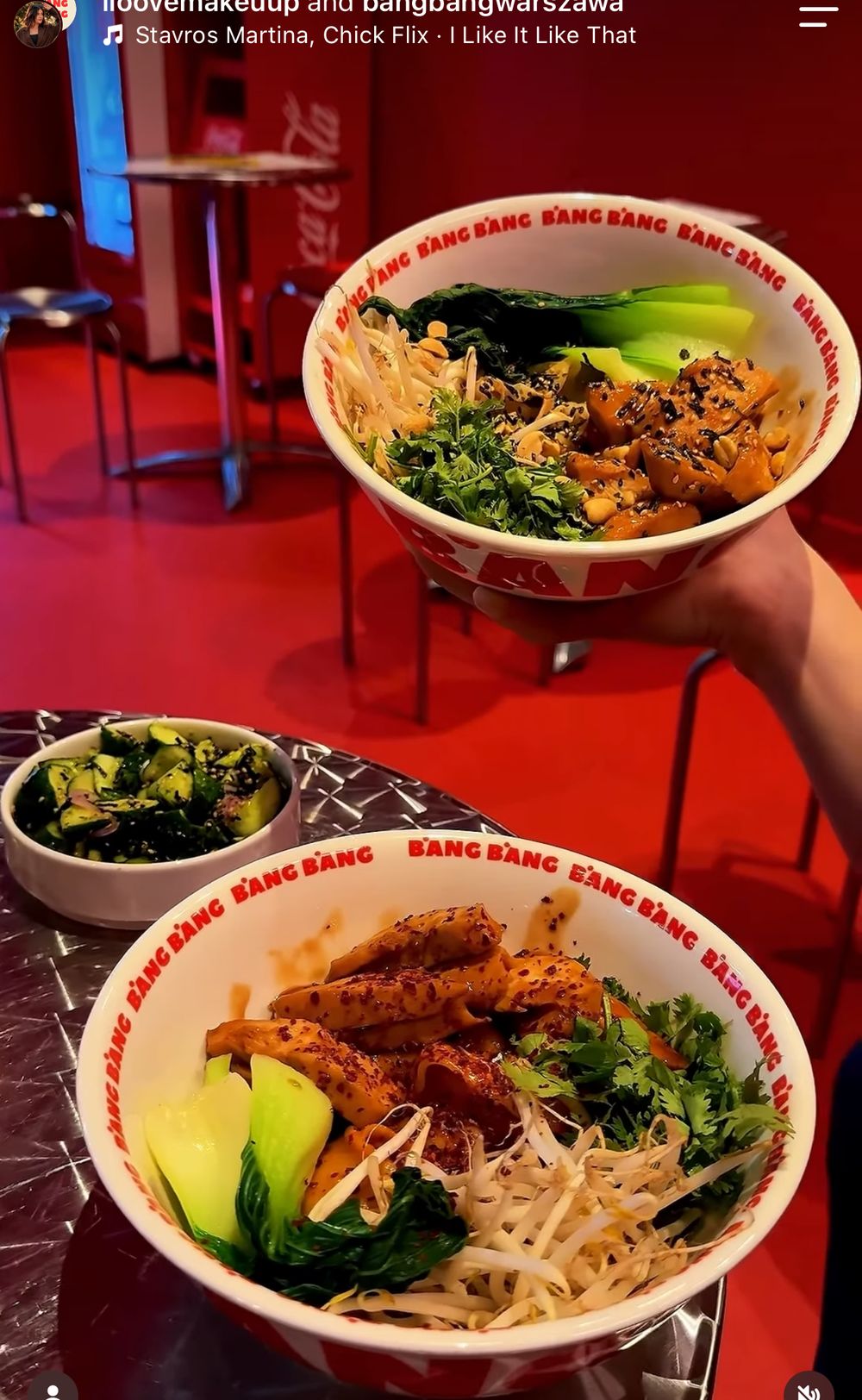 Curry bowl with chicken, pak choi, sprouts and herbs on a chrome table