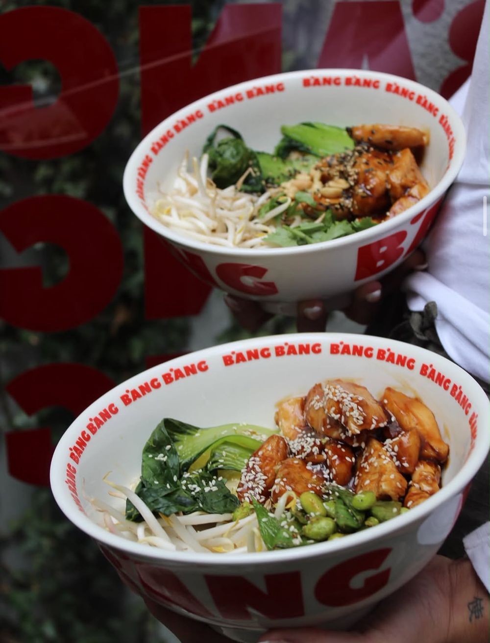 Two Little Peanut bowls with teriyaki chicken, pak choi and sprouts