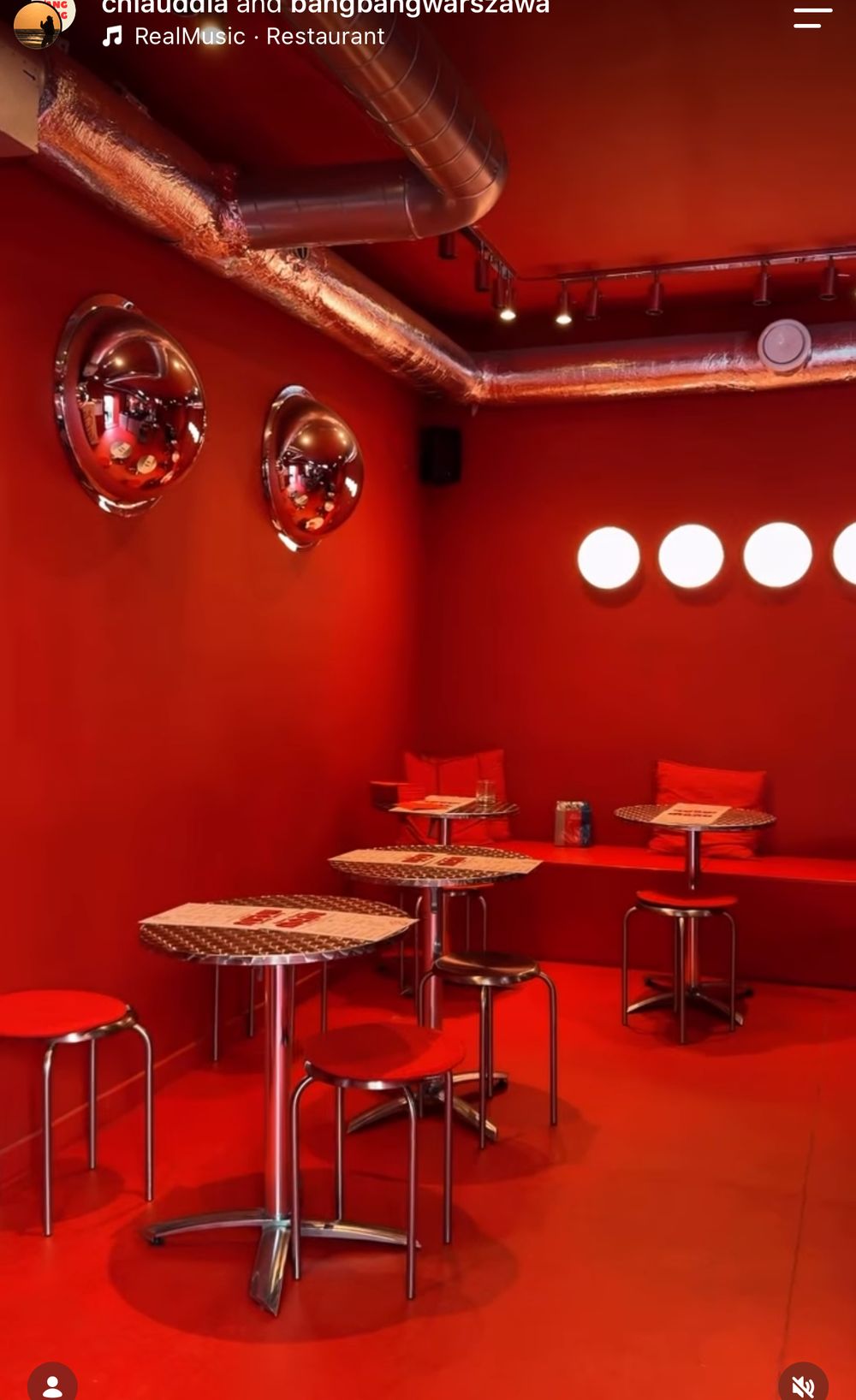 The all-red dining room with chrome tables and red stools
