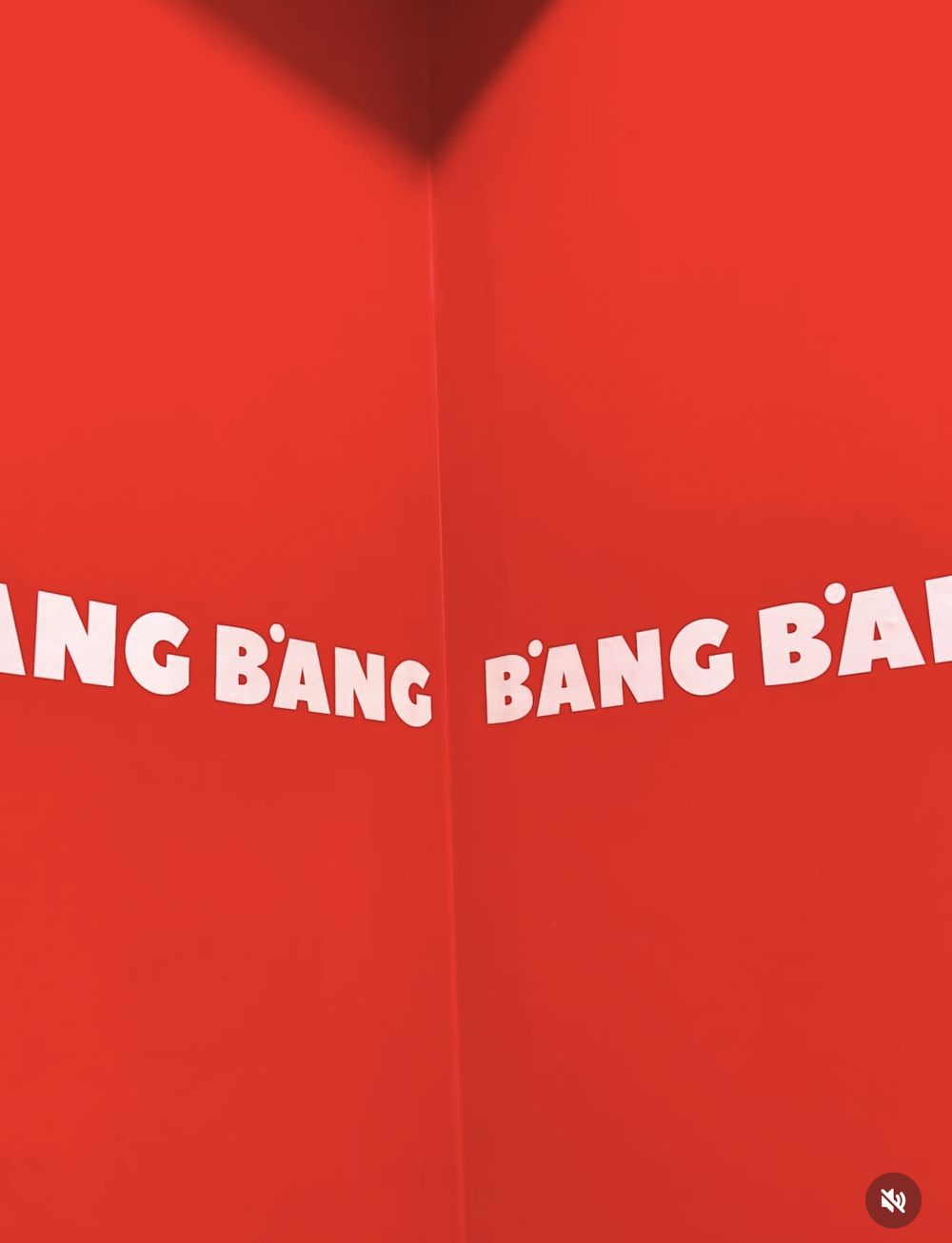 BANG BANG lettering on the red wall